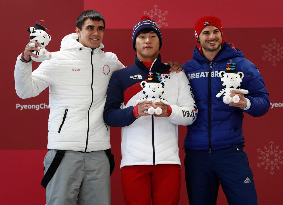  Gold medallist Yun Sung-bin of South Korea, silver medallist Nikita Tregubov, an Olympic athlete from Russia, and bronze medallist Dom Parsons for Team GB