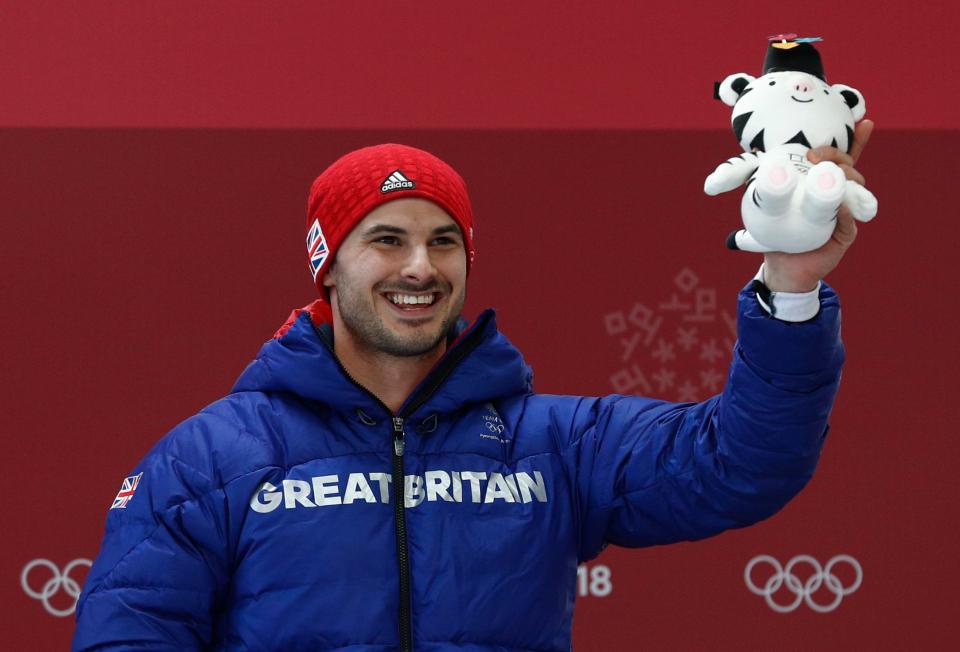  Bronze medallist Dom Parsons of Britain poses with his winning cuddly toy at the victory ceremony