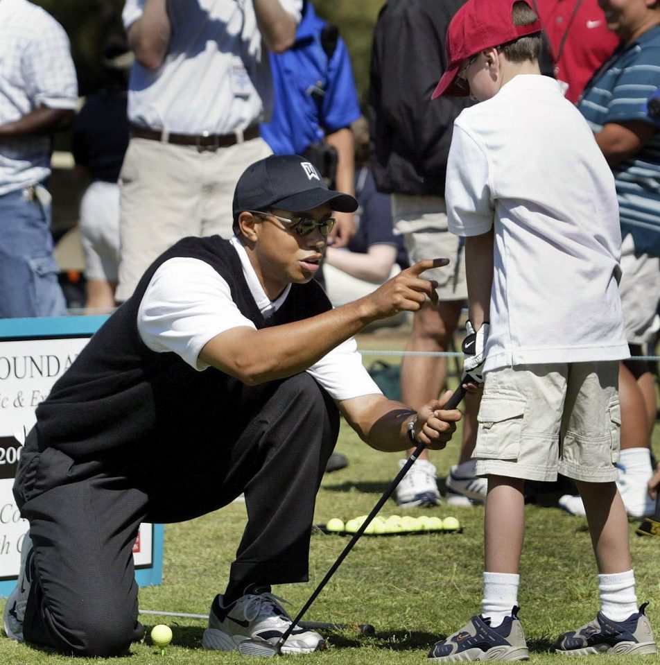  Earlier in the day Woods was happy to sign an autograph to a young golfing enthusiast