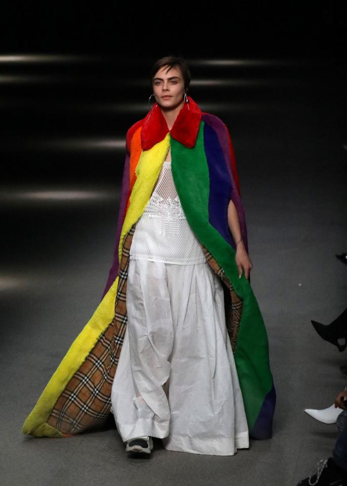  Cara wore a floor-length, rainbow-coloured coat to close Burberry's London Fashion Week show