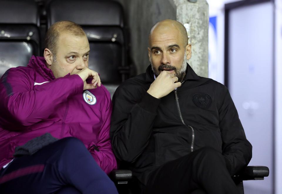  Pep Guardiola and coach Rodolfo Borrell during City's FA Cup defeat to Wigan