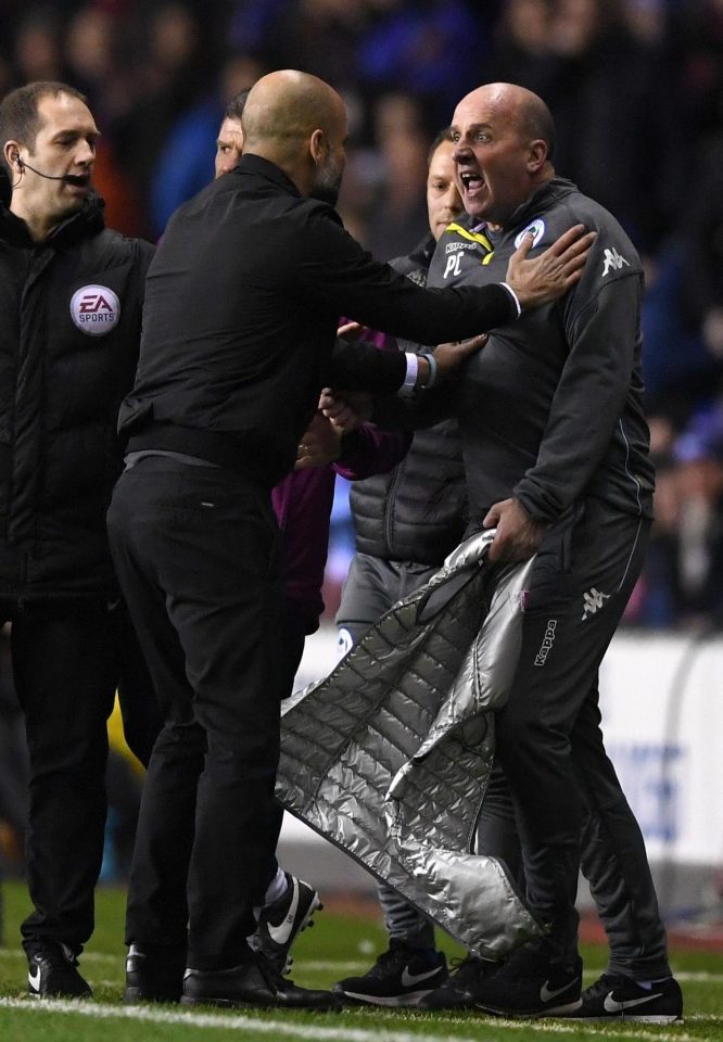  Pep Guardiola then laid his hands on Wigan boss Paul Cook as the fuse was well and truly lit