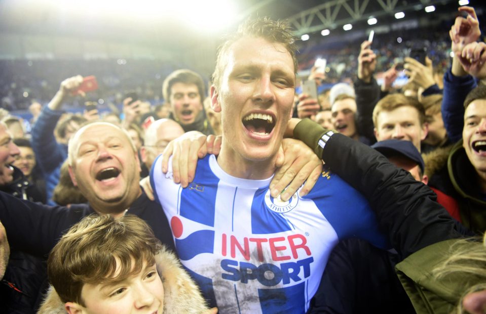  It was not all bad at full-time as Dan Burn and his Wigan team-mates celebrated with fans