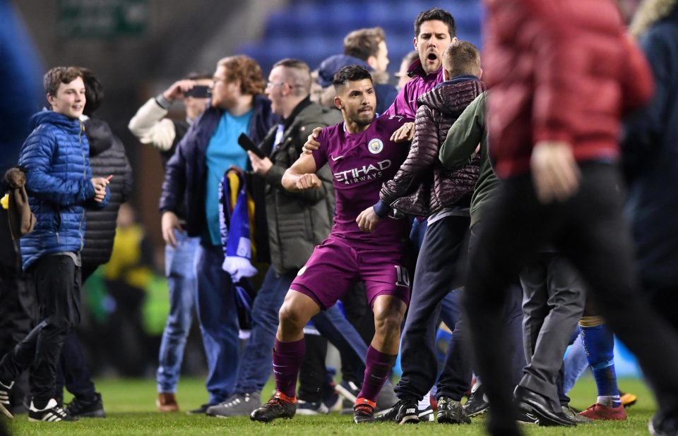  Sergio Aguero was seen to lash out at a fan who invaded the pitch at full-time