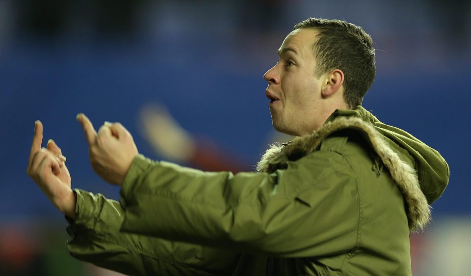  A Wigan fan taunts City fans after their 1-0 FA Cup win