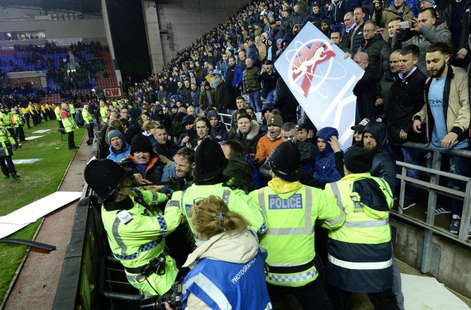  One City fan appeared to scuffle with police on the edge of the pitch