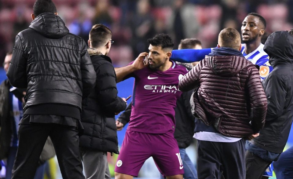  Wigan defender Chey Dunkley was one of those who had to restrain Sergio Aguero