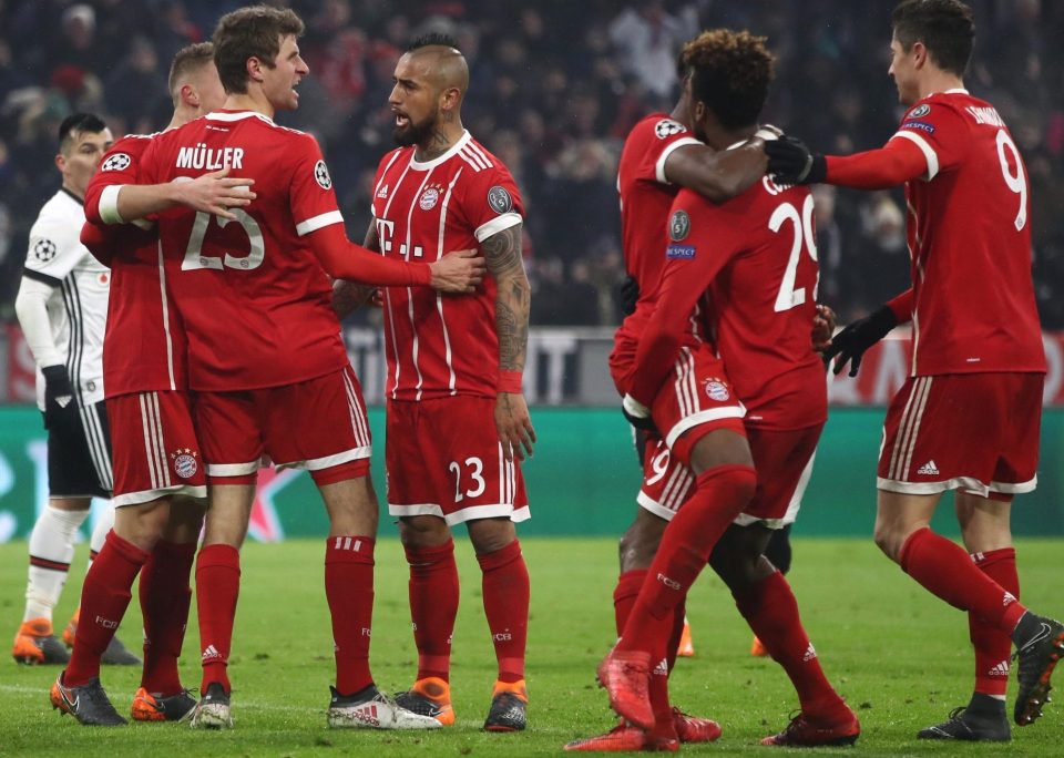  Thomas Muller is mobbed by Bayern team-mates after launching the spree