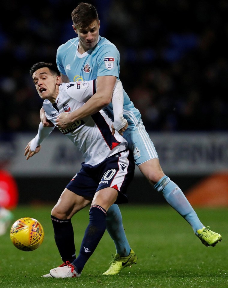 Paddy McNair tries to get to grips with Bolton loan hero Zach Clough