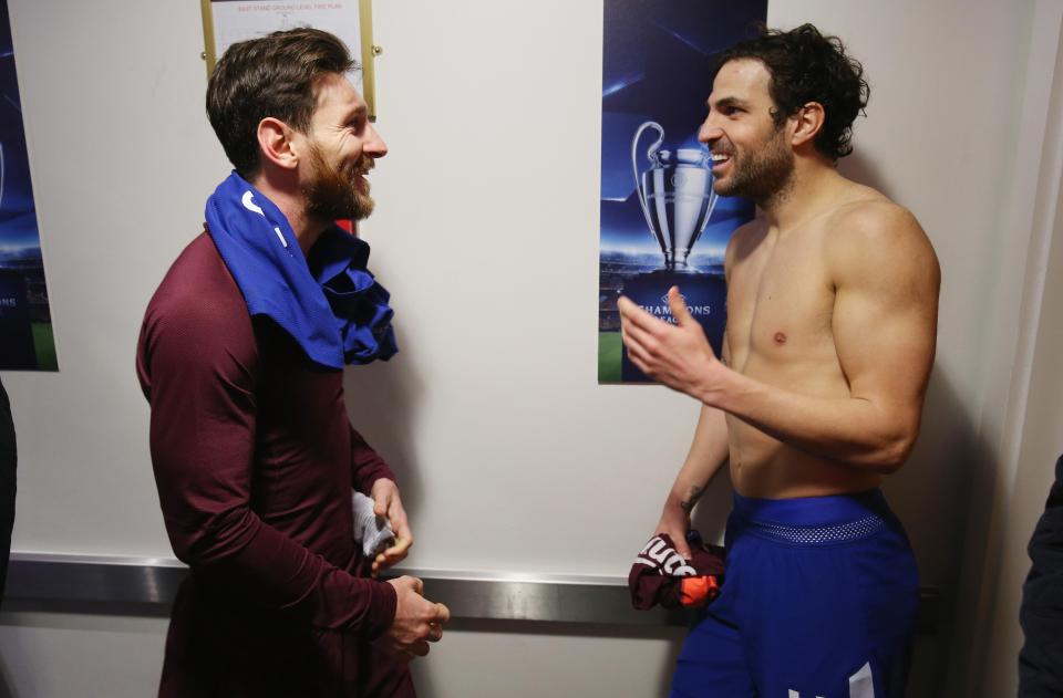  Cesc Fabregas chats to Barcelona goalscorer Lionel Messi after the 1-1 draw