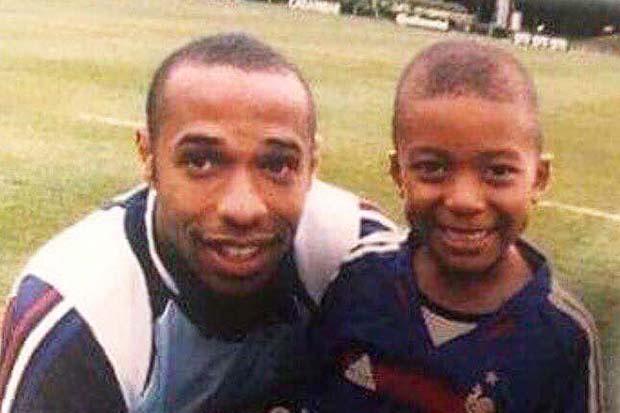  Kylian Mbappe looks delighted to be snapped with Thierry Henry