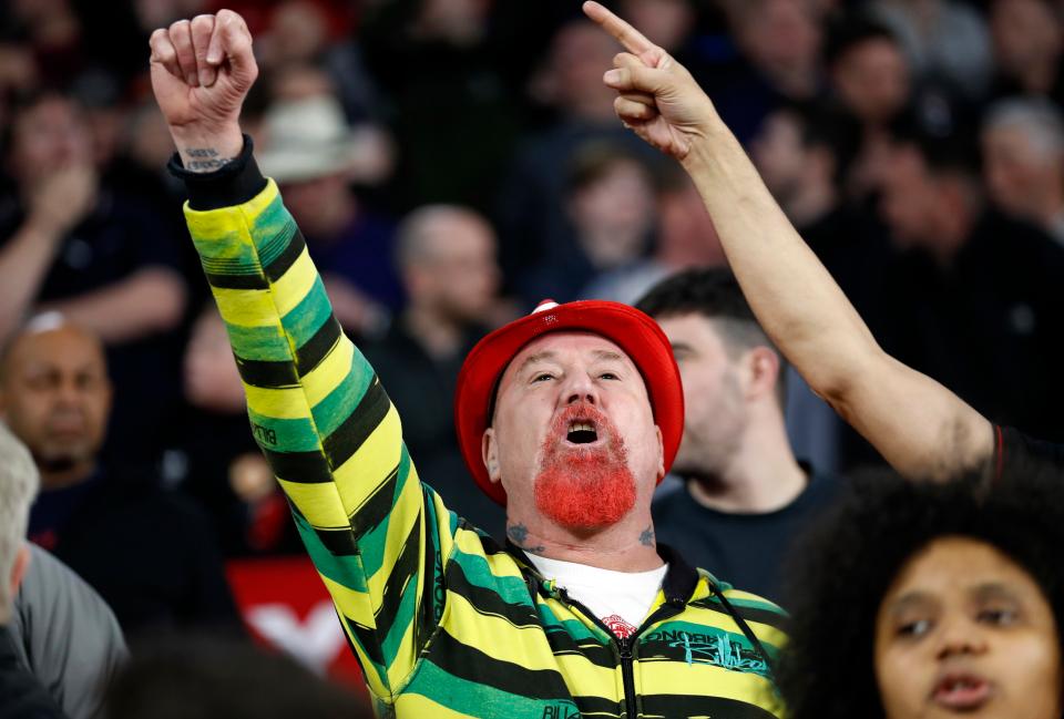  A Manchester United supporter cheers on his team on their trip to Seville