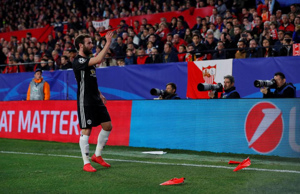  Paper airplanes surround Mata during the Champions League clash