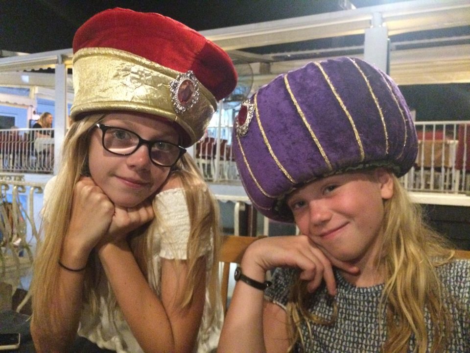  Mia, left, and Orla embracing Turkish culture by wearing Turkish hats at Baharat restaurant