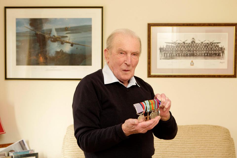  Johnny shows off some of the medals he received for fighting Hitler's Nazis