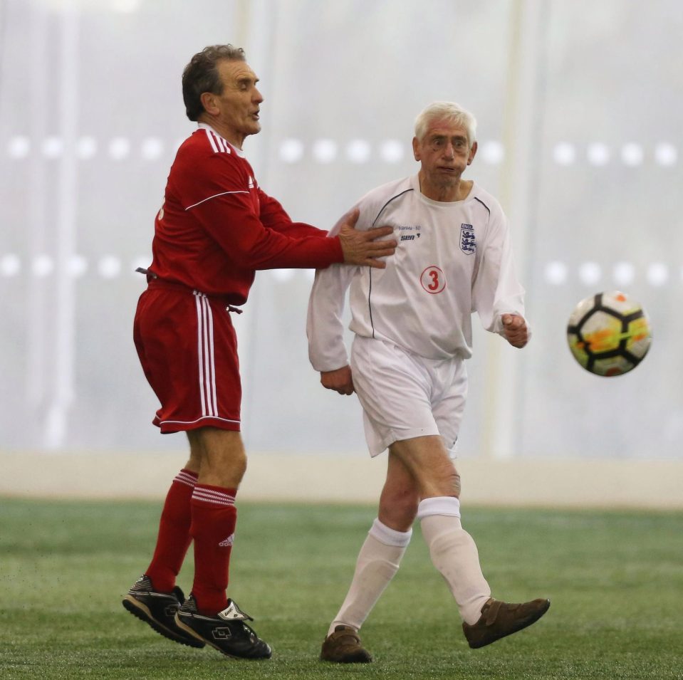  John Shannon Junior shields the ball against Wales as his dad watches on