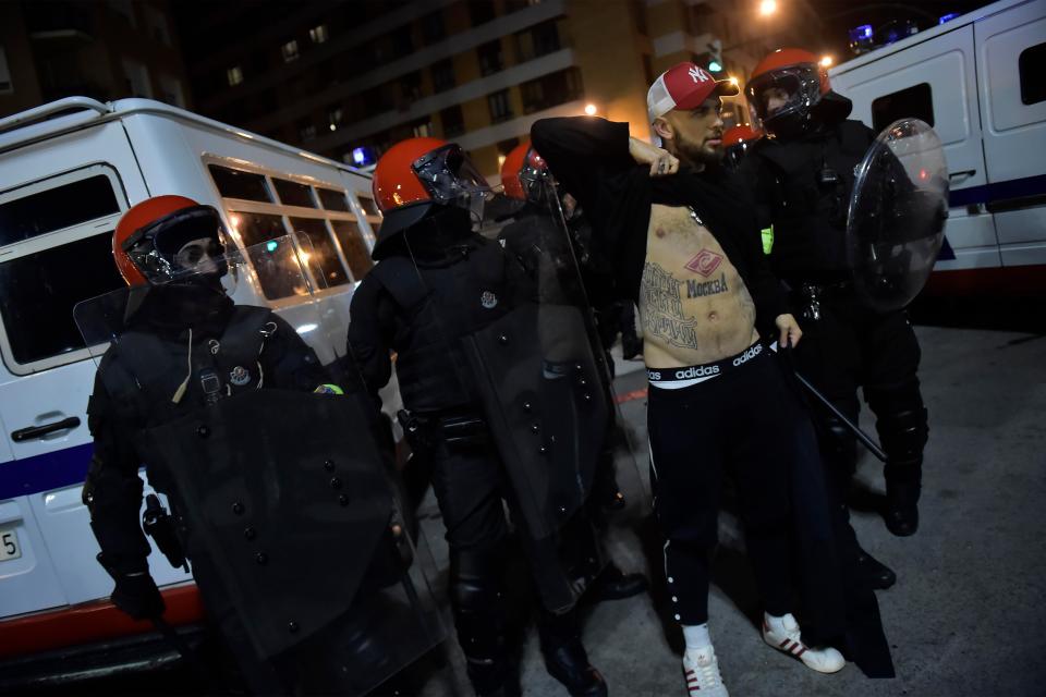  A Spartak Moscow fan is held by police