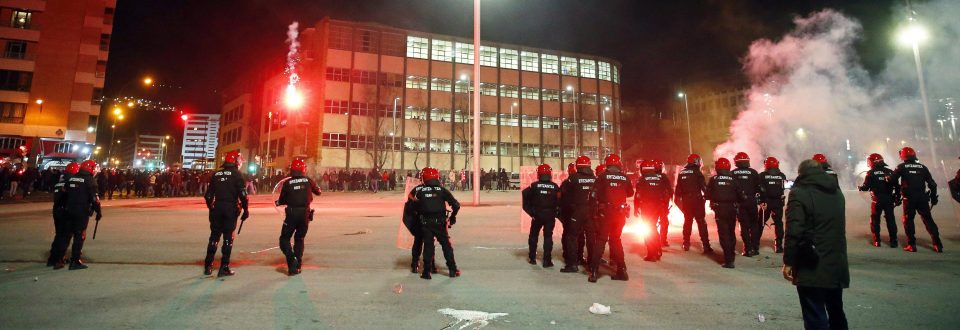  Fans line up against riot squad police on the streets