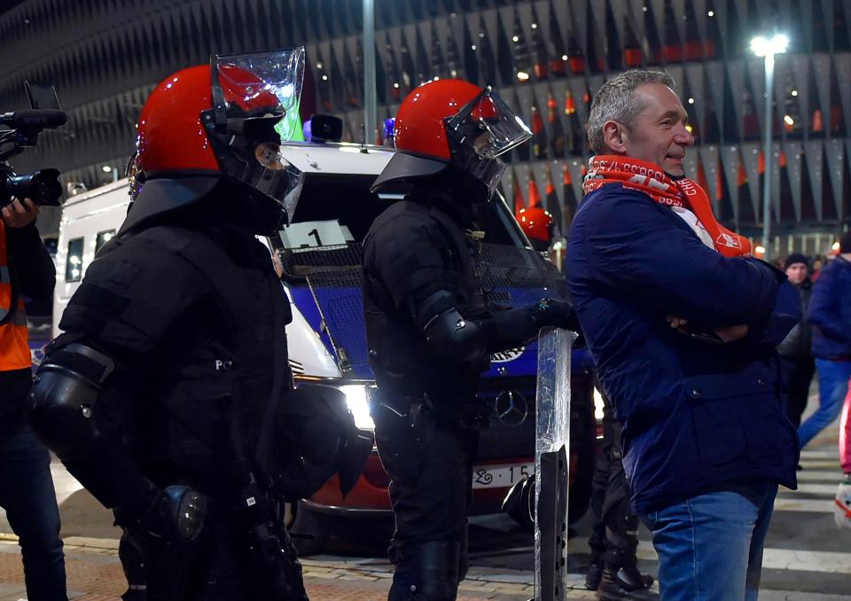  A Spartak fan poses in front of police