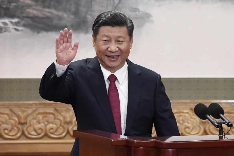  This photo shows Chinese President Xi Jinping waving at the Great Hall of the People in Beijing. He could now rule beyond 2023