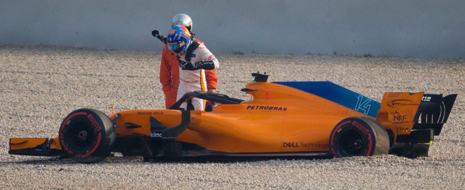  Fernando Alonso leaves his car after crashing during testing in Barcelona