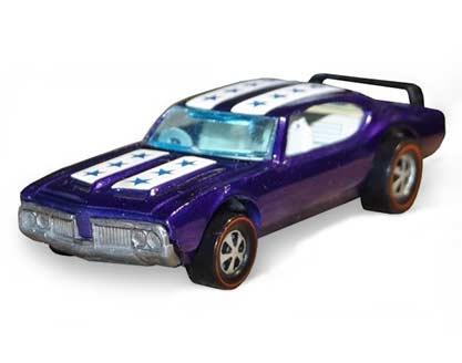  This purple Olds 442 model is only complete with a spoiler