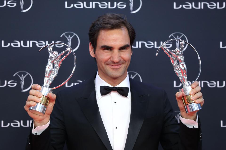  Tennis legend Roger Federer poses for a picture with his trophies