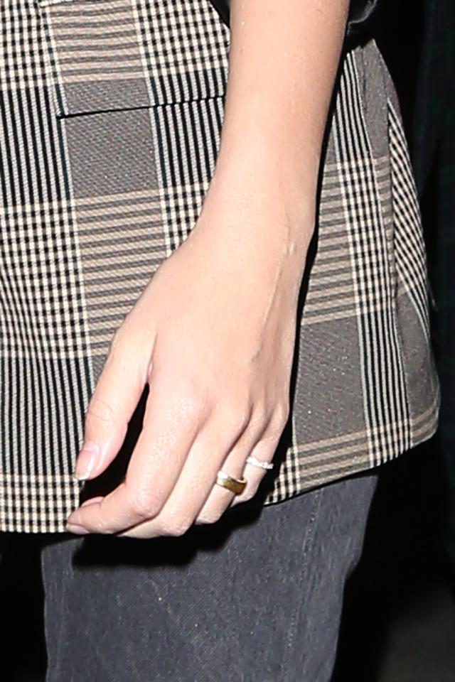  Emily's wedding ring is a simple gold band