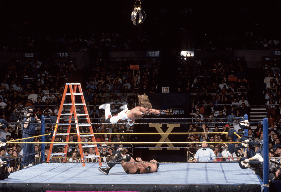  Shawn Michaels splashes Razor Ramon from the ladder