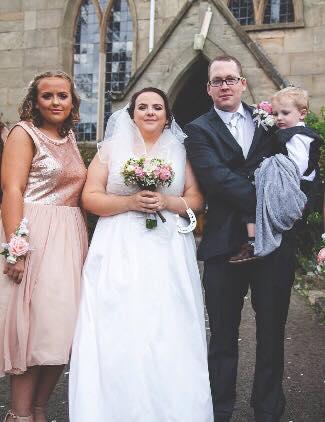  Charlene and Kieran Telford on their wedding day in October last year with her daughter Tia and their son, Sebastian