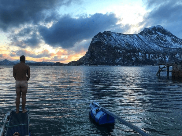  The 44-year-old strips completely naked and enjoys a spot of skinny dipping in the Artic sea