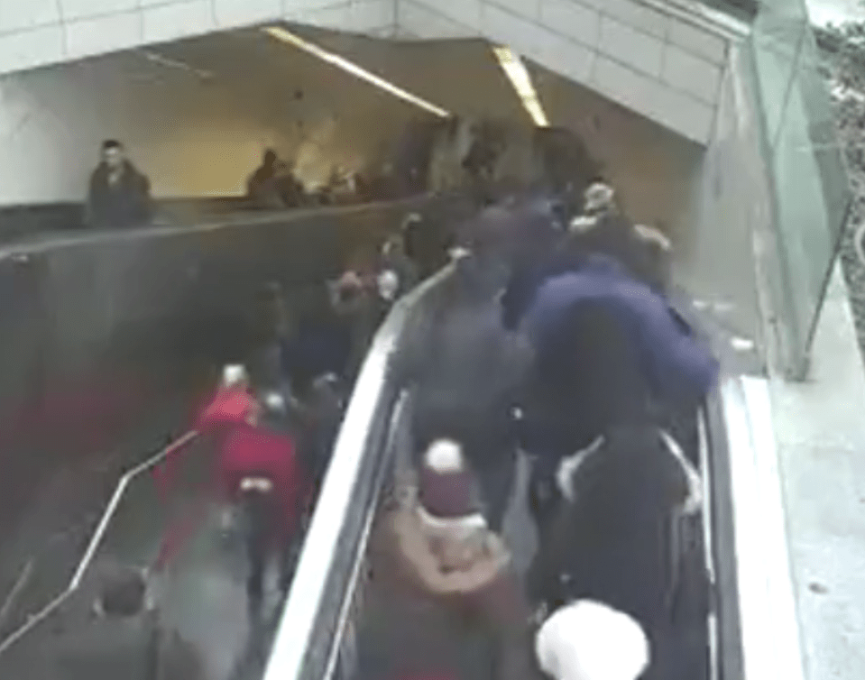  Commuters use the broken escalator despite warnings it is closed