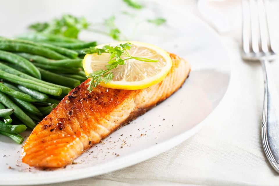  Eating oily fish like salmon, with a healthy side of leafy greens, three times a week can up levels of omega-3, essential fatty acids that help fight the condition