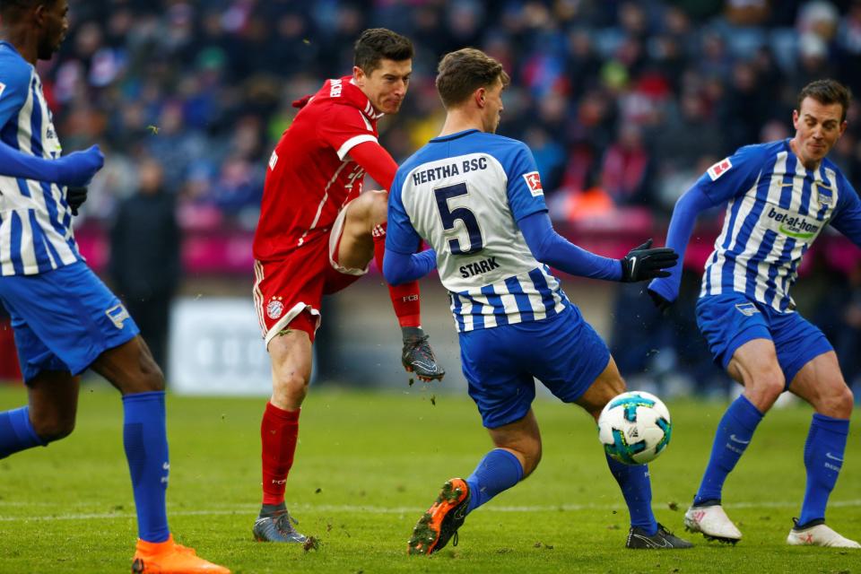  Robert Lewandowski takes a shot on goal during Bayern Munich's clash with Hertha Berlin