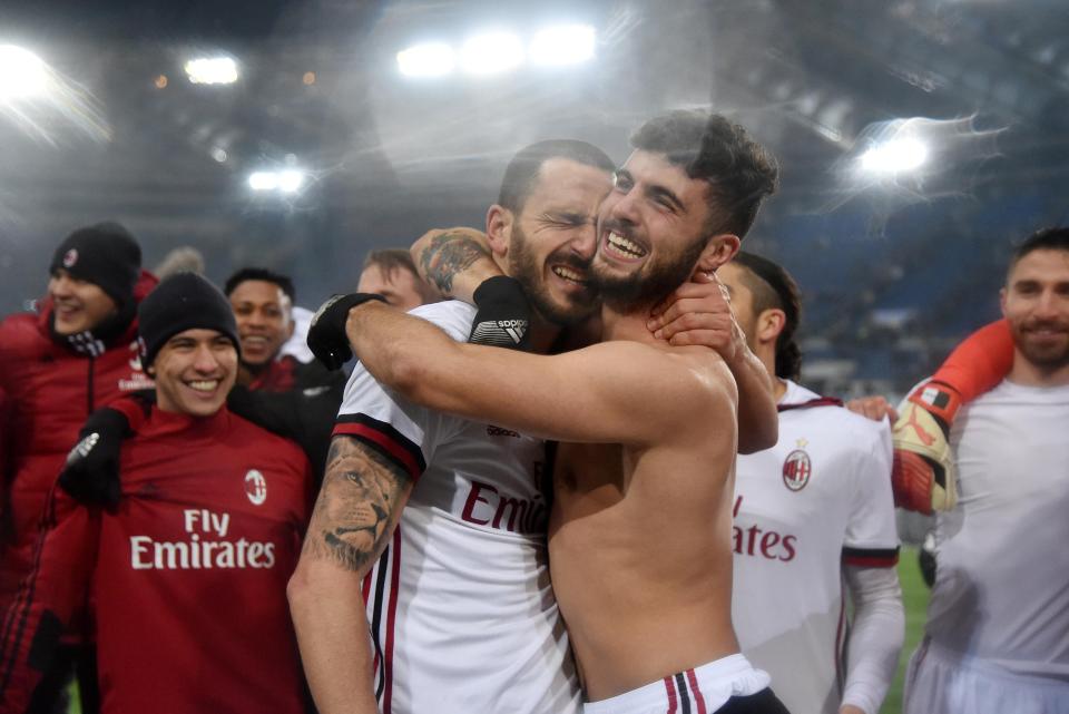  AC Milan's Patrick Cutrone and Leonardo Bonucci celebrate after winning the penalty shoot-out