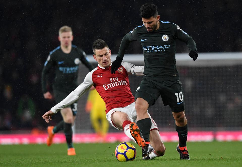  Laurent Koscielny flies into a challenge during Arsenal's defeat to Manchester City