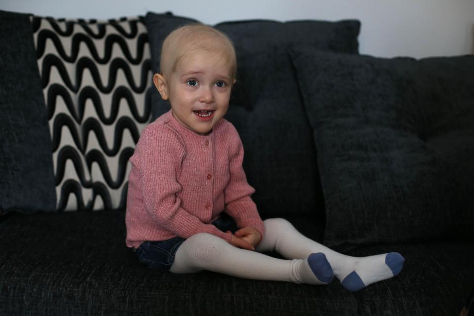  The two-year-old worried her parents when flu-like symptoms progressed until she couldn't walk