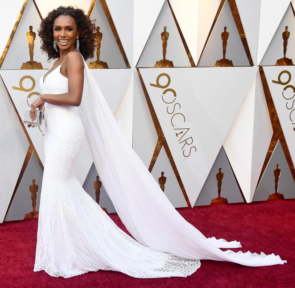  US writer and transgender rights activist Janet Mock turned heads in an elegant lace ivory gown and cape