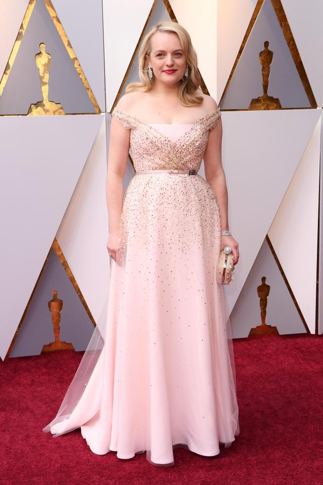  Elisabeth Moss looked stunning in her off-the-shoulder powder pink number that was adorned with hundreds of diamantes