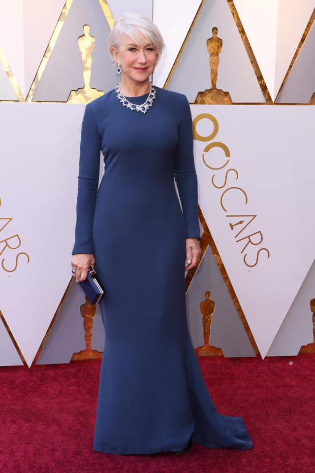  Movie legend Helen Mirren looked elegant in a long-sleeved dark blue gown and sapphire jewellery