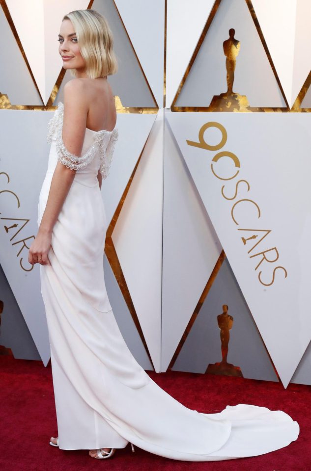  Margot's stunning Chanel gown featured an elegant train. She paired the chic frock with towering white stilettos