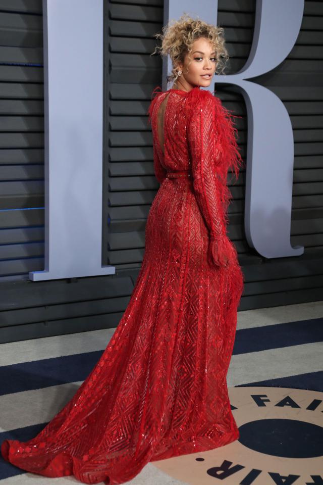  British singer Rita Ora looked sensational in a flowing, scarlet gown