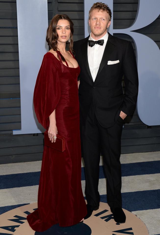  Emily stunned in a magnificent maroon gown while her husband Sebastian wore a traditional tux.