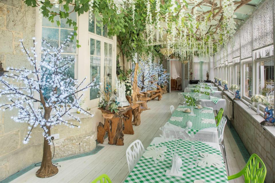  Guests eat in a room that looks to have come straight from a woodland scene