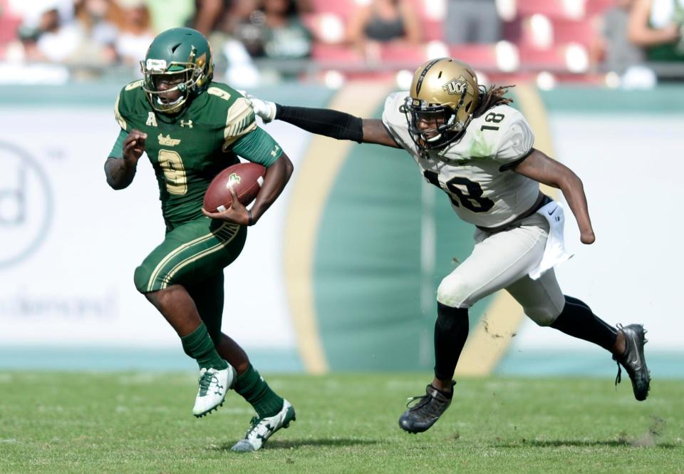  Shaquem attempts to tackle a rival player with the ball while playing for University of Central Florida