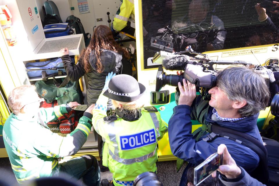  The women were escorted out of the offices and into an ambulance in dramatic fashion