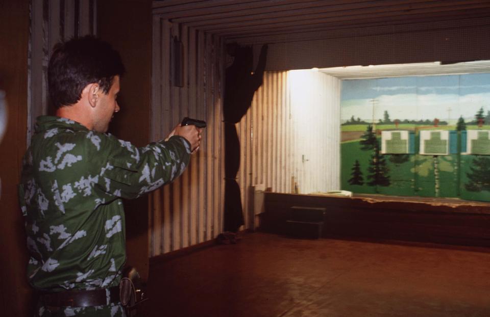  An instructor shows off his deadly aim on the school's shooting range