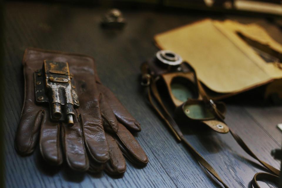  A gun incorporated into the back of a spy's leather glove