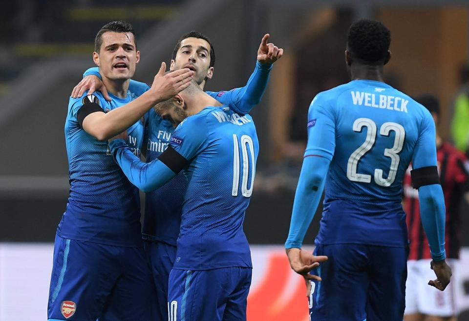  Arsenal players celebrate Mkhitaryan's early goal against the Serie A giants