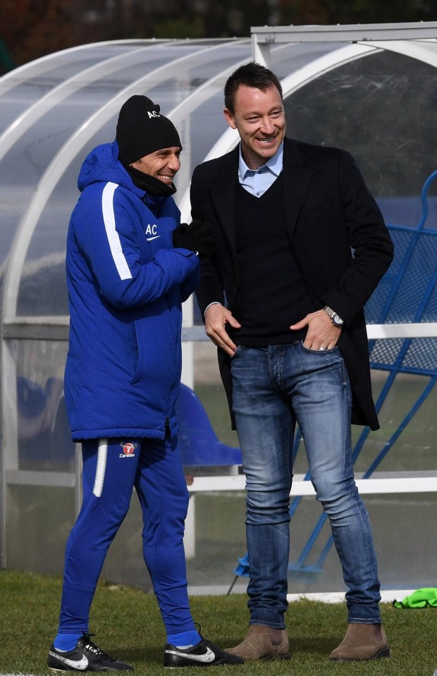 John Terry shares a laugh with Antonio Conte during a visit to Cobham